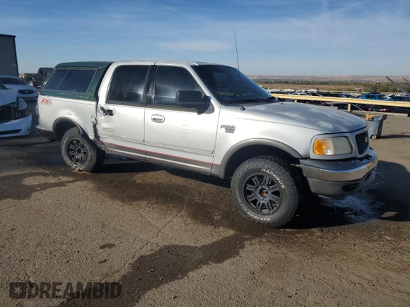 2002 Ford F-150 XLT with VIN 1FTRW08L12KA86849, listed as a Copart auction lot 77861574 with 0 mi miles and Salvage Title. Bid and sale history available at carsss.com. Image 4.