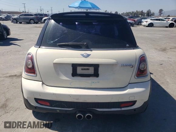 2009 MINI Hardtop S with VIN WMWMF73569TW80561, listed as a Copart auction lot 52615805 with 109,968 mi miles and Salvage title. Bid and sale history available at DreamBid. Image 6.
