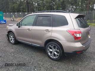 2015 Subaru Forester Touring with VIN JF2SJAUC1FH457069, listed as a IAAI auction lot 42293542 with 71,689 mi miles and . Bid and sale history available at DreamBid. Image 3.
