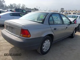 1999 Saturn SL z VIN 1G8ZH5280XZ249494, wystawiony jako IAAI lot #42347493 z przebiegiem 106 491 mil mil oraz . Historia ofert i sprzedaży dostępna na DreamBid. Obrazek 4.