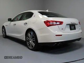 2014 Maserati Ghibli S Q4 z VIN ZAM57RTA7E1094580, wystawiony jako Copart lot #52009445 z przebiegiem 79 463 mil mil oraz Szkoda całkowita • Salvage title. Historia ofert i sprzedaży dostępna na DreamBid. Obrazek 4.