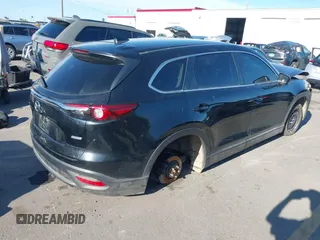 2018 Mazda CX-9 Sport with VIN JM3TCBBY6J0222750, listed as a IAAI auction lot 42294464 with 63,927 mi miles and . Bid and sale history available at DreamBid. Image 4.
