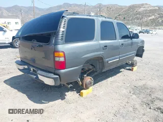 2001 Chevrolet Tahoe LS z VIN 1GNEC13T51J153677, wystawiony jako IAAI lot #42459552 z przebiegiem 201 209 mil mil oraz . Historia ofert i sprzedaży dostępna na DreamBid. Obrazek 4.