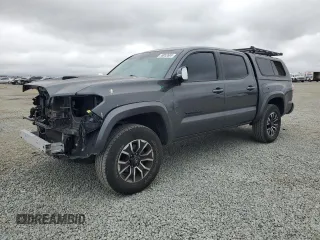 2020 Toyota Tacoma SR5 z VIN 3TMAZ5CN6LM133409, wystawiony jako Copart lot #59052665 z przebiegiem 81 852 mil mil oraz Szkoda całkowita • Salvage title. Historia ofert i sprzedaży dostępna na DreamBid. Obrazek 1.