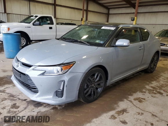 2014 Scion tC z VIN JTKJF5C7XE3071780, wystawiony jako Copart lot #47220975 z przebiegiem 102 630 mil mil oraz Szkody całkowita. Historia ofert i sprzedaży dostępna na DreamBid. Obrazek 1.