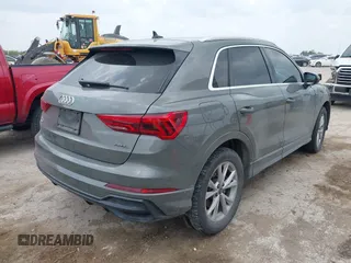 2021 Audi Q3 S line Premium z VIN WA1DECF33M1040282, wystawiony jako IAAI lot #42162587 z przebiegiem 90 509 mil mil oraz . Historia ofert i sprzedaży dostępna na DreamBid. Obrazek 4.