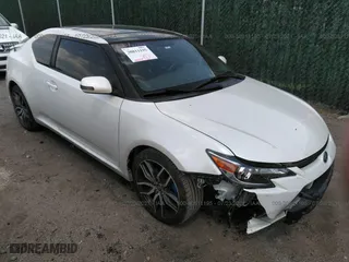 2015 Scion tC with VIN JTKJF5C75F3096734, listed as a IAAI auction lot 30811195 with 88,879 mi miles. Bid and sale history available at carsss.com. Image 1.