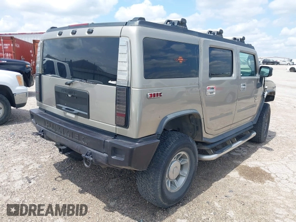 2003 Hummer H2 with VIN 5GRGN23U23H148326, listed as a IAAI auction lot 42068326 with 149,396 mi miles. Bid and sale history available at carsss.com. Image 4.