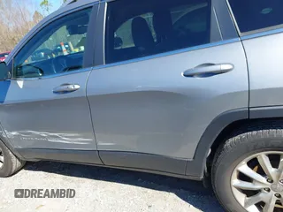 2016 Jeep Cherokee Limited with VIN 1C4PJLDB8GW239294, listed as a IAAI auction lot 41675712 with 140,491 mi miles. Bid and sale history available at carsss.com. Image 14.