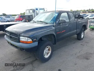 1999 Dodge Dakota SLT with VIN 1B7GG22YXXS229633, listed as a IAAI auction lot 42088939 with 148,049 mi miles and . Bid and sale history available at carsss.com. Image 2.