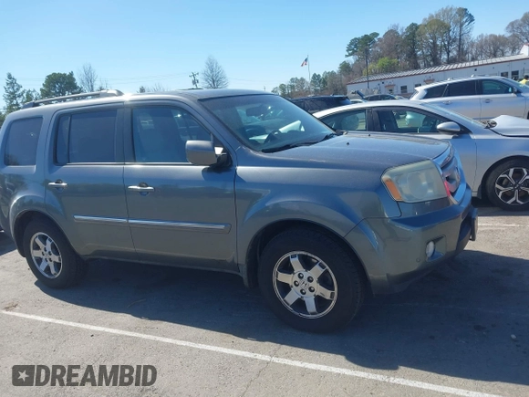 2010 Honda Pilot Touring with VIN 5FNYF4H94AB031167, listed as a IAAI auction lot 41800738 with 184,126 mi miles and . Bid and sale history available at carsss.com. Image 13.