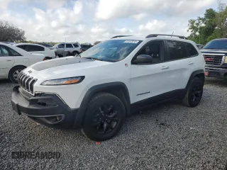 2015 Jeep Cherokee Trailhawk with VIN 1C4PJMBS4FW668147, listed as a Copart auction lot 51647015 with 116,859 mi miles and Salvage Title. Bid and sale history available at carsss.com. Image 1.
