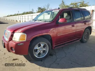 2006 GMC Envoy Denali with VIN 1GKES63M762237958, listed as a Copart auction lot 76999574 with 180,294 mi miles and Clean Title. Bid and sale history available at carsss.com. Image 1.