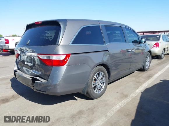 2011 Honda Odyssey EX-L with VIN 5FNRL5H6XBB083980, listed as a IAAI auction lot 42100308 with 191,361 mi miles and . Bid and sale history available at carsss.com. Image 4.
