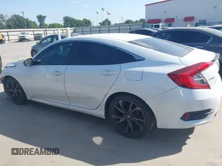 2019 Honda Civic Sport with VIN 19XFC2F81KE024702, listed as a IAAI auction lot 42018077 with 98,613 mi miles and . Bid and sale history available at DreamBid. Image 14.