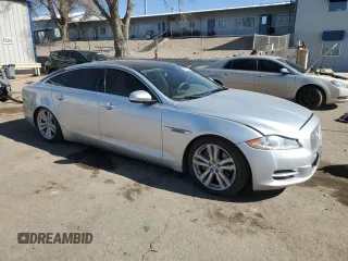 2014 Jaguar XJ Portfolio with VIN SAJWA2GZ2E8V70065, listed as a Copart auction lot 43872505 with 138,677 mi miles and Salvage title. Bid and sale history available at DreamBid. Image 4.