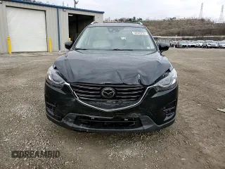 2016 Mazda CX-5 Grand Touring with VIN JM3KE4DY2G0738899, listed as a Copart auction lot 50943255 with 80,807 mi miles and Salvage Title. Bid and sale history available at carsss.com. Image 11.