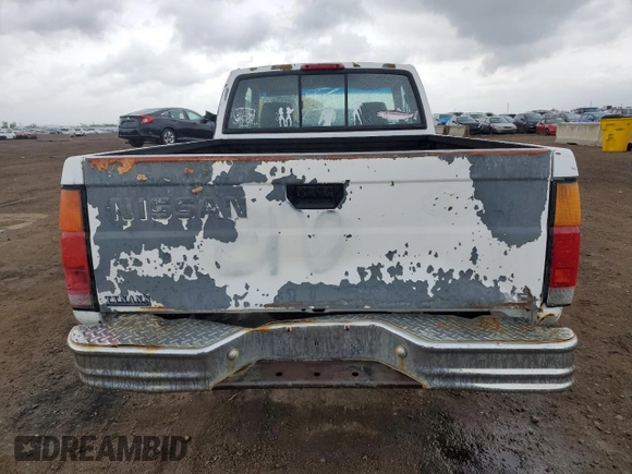 1997 Nissan Frontier XE with VIN 1N6SD16S8VC426940, listed as a Copart auction lot 55860235 with 242,265 mi miles and Salvage title. Bid and sale history available at DreamBid. Image 6.