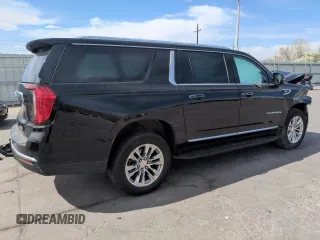 2023 GMC Yukon XL SLT z VIN 1GKS2GKD3PR282110, wystawiony jako Copart lot #52950425 z przebiegiem 99 147 mil mil oraz Szkoda całkowita • Salvage title. Historia ofert i sprzedaży dostępna na DreamBid. Obrazek 3.