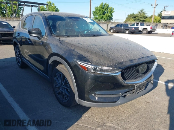 2018 Mazda CX-5 Grand Touring with VIN JM3KFBDM1J0345014, listed as a IAAI auction lot 42703926 with 151,453 mi miles and . Bid and sale history available at DreamBid. Image 1.