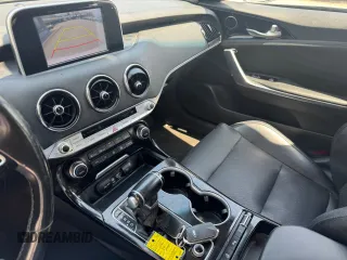 2018 Kia Stinger with VIN KNAE15LA7J6031245, listed as a Copart auction lot 55879285 with 144,020 mi miles and Clean Title. Bid and sale history available at carsss.com. Image 9.