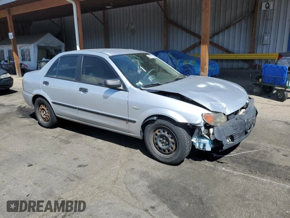 2003 Mazda Protege DX with VIN JM1BJ225730217866, listed as a Copart auction lot 53854075 with 105,782 mi miles and Salvage Title. Bid and sale history available at DreamBid. Image 4.