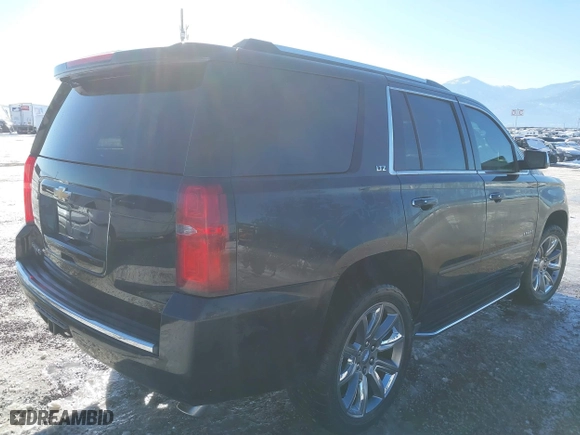 2016 Chevrolet Tahoe LTZ with VIN 1GNSKCKC7GR420945, listed as a IAAI auction lot 41414565 with 134,465 mi miles. Bid and sale history available at carsss.com. Image 4.