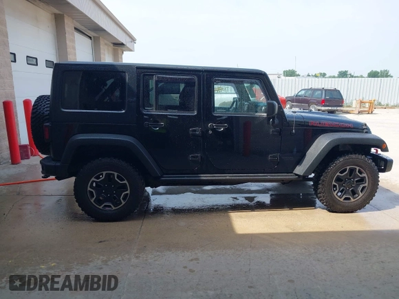 2015 Jeep Wrangler Unlimited Rubicon Hard Rock с VIN 1C4HJWFG0FL550247, выставлен на аукционе IAAI как лот 42474614 с пробегом 93 084 миль миль и . История ставок и продаж доступна на DreamBid. Изображение 13.