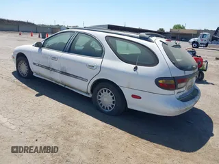 1996 Mercury Sable z VIN 1MELM55U0TG623025, wystawiony jako IAAI lot #42320328 z przebiegiem 235 325 mil mil oraz . Historia ofert i sprzedaży dostępna na DreamBid. Obrazek 3.