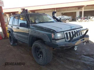 1994 Jeep Grand Cherokee Laredo z VIN 1J4GZ58S4RC280650, wystawiony jako IAAI lot #42041261 z przebiegiem 199 265 mil mil oraz . Historia ofert i sprzedaży dostępna na DreamBid. Obrazek 1.