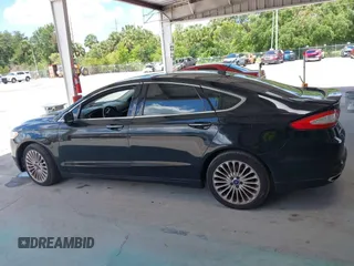 2016 Ford Fusion Titanium with VIN 3FA6P0K99GR235692, listed as a IAAI auction lot 42587743 with 169,467 mi miles and . Bid and sale history available at DreamBid. Image 14.