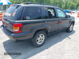 2004 Jeep Grand Cherokee with VIN 1J8GW48N94C135866, listed as a IAAI auction lot 42419888 with 326,880 mi miles and . Bid and sale history available at DreamBid. Image 4.