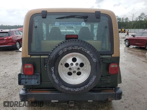1997 Jeep Wrangler Sahara with VIN 1J4FY49SXVP453369, listed as a Copart auction lot 72826744 with 145,852 mi miles and Salvage Title. Bid and sale history available at carsss.com. Image 6.