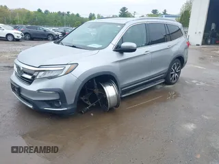2020 Honda Pilot Touring 8-Passenger z VIN 5FNYF6H91LB042626, wystawiony jako IAAI lot #42249440 z przebiegiem 57 429 mil mil oraz . Historia ofert i sprzedaży dostępna na DreamBid. Obrazek 17.