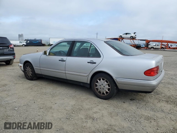 1999 Mercedes-Benz E-Class with VIN WDBJF65H0XA797390, listed as a Copart auction lot 55081405 with 80,950 mi miles and Salvage Title. Bid and sale history available at carsss.com. Image 2.