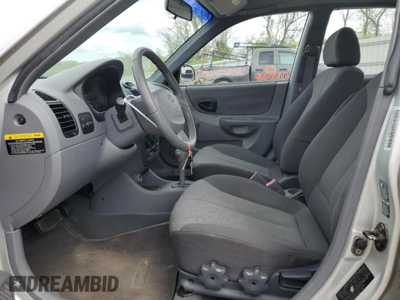 2004 Hyundai Accent GL with VIN KMHCG45C94U515186, listed as a Copart auction lot 52697284 with 49,236 mi miles and Salvage Title. Bid and sale history available at carsss.com. Image 7.
