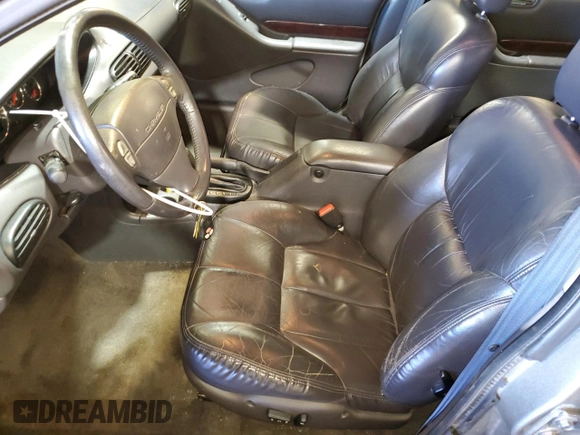 1999 Chrysler Cirrus LXi z VIN 1C3EJ56H5XN516255, wystawiony jako Copart lot #48552575 z przebiegiem 69 616 mil mil oraz Szkody całkowita. Historia ofert i sprzedaży dostępna na DreamBid. Obrazek 7.
