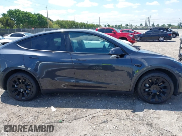 2024 Tesla Model Y with VIN 7SAYGDED3RF019063, listed as a IAAI auction lot 42061888 with 13,763 mi miles and . Bid and sale history available at DreamBid. Image 12.