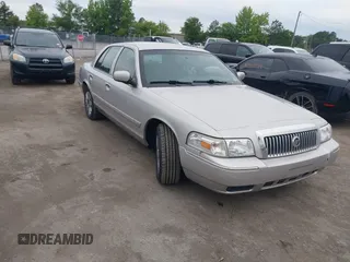2006 Mercury Grand Marquis GS z VIN 2MEFM74V16X646802, wystawiony jako IAAI lot #42358697 z przebiegiem 169 321 mil mil oraz . Historia ofert i sprzedaży dostępna na DreamBid. Obrazek 1.