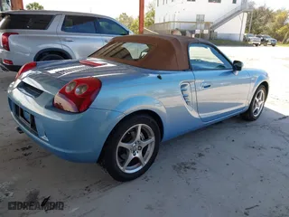 2003 Toyota MR2 Spyder with VIN JTDFR320130057360, listed as a IAAI auction lot 41696384 with 52,621 mi miles. Bid and sale history available at carsss.com. Image 4.