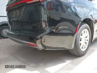 2023 Chrysler Pacifica Touring L with VIN 2C4RC1BG1PR550628, listed as a IAAI auction lot 42553430 with 61,773 mi miles and . Bid and sale history available at DreamBid. Image 21.