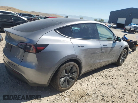 2024 Tesla Model Y Long Range with VIN 7SAYGDEE6RA321064, listed as a Copart auction lot 58889795 with 48,857 mi miles and Salvage title. Bid and sale history available at DreamBid. Image 3.