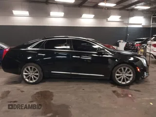 2013 Cadillac XTS Luxury z VIN 2G61R5S34D9102625, wystawiony jako IAAI lot #41668752 z przebiegiem 112 065 mil mil oraz . Historia ofert i sprzedaży dostępna na DreamBid. Obrazek 13.