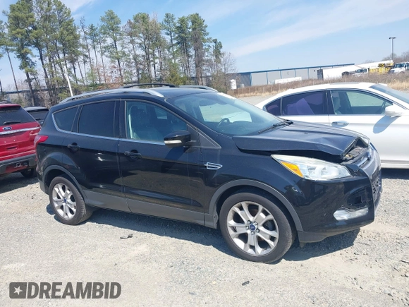 2016 Ford Escape Titanium with VIN 1FMCU0JX8GUC06601, listed as a IAAI auction lot 41785774 with 121,427 mi miles. Bid and sale history available at carsss.com. Image 13.