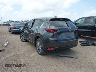 2021 Mazda CX-5 Grand Touring with VIN JM3KFBDM2M0431484, listed as a IAAI auction lot 42547665 with 34,757 mi miles and . Bid and sale history available at DreamBid. Image 3.