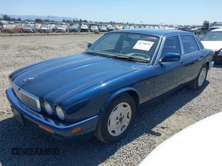 1996 Jaguar XJ with VIN SAJHX1740TC766425, listed as a IAAI auction lot 42758458 with 257,849 mi miles and . Bid and sale history available at DreamBid. Image 2.