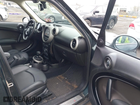 2011 MINI Countryman S with VIN WMWZC5C54BWL54135, listed as a IAAI auction lot 42034897 with 130,082 mi miles and . Bid and sale history available at DreamBid. Image 5.
