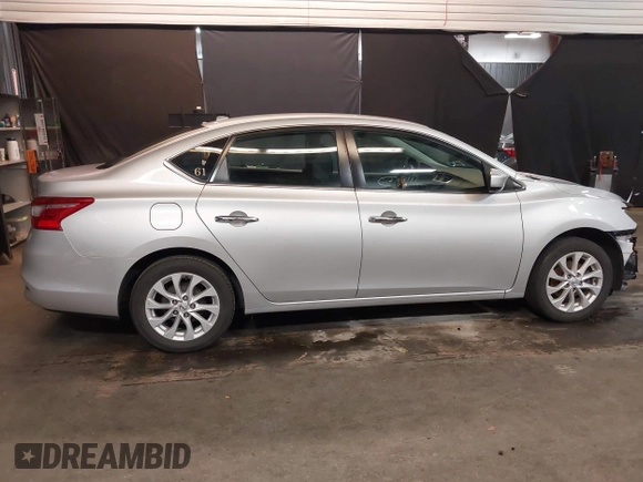2018 Nissan Sentra S with VIN 3N1AB7AP0JY227296, listed as a IAAI auction lot 41950972 with 57,984 mi miles and . Bid and sale history available at DreamBid. Image 14.
