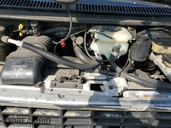 1994 Chevrolet Chevy Van z VIN 1GBEG25K3RF178166, wystawiony jako Copart lot #69173594 z przebiegiem 143 577 mil mil oraz Szkody całkowita. Historia ofert i sprzedaży dostępna na DreamBid. Obrazek 11.