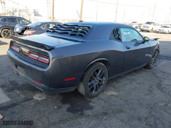 2021 Dodge Challenger GT with VIN 2C3CDZKG4MH677574, listed as a IAAI auction lot 41460036 with 67,170 mi miles. Bid and sale history available at carsss.com. Image 4.